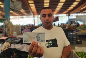 A�k�n� paralara yaz�p pazarda da��tt�